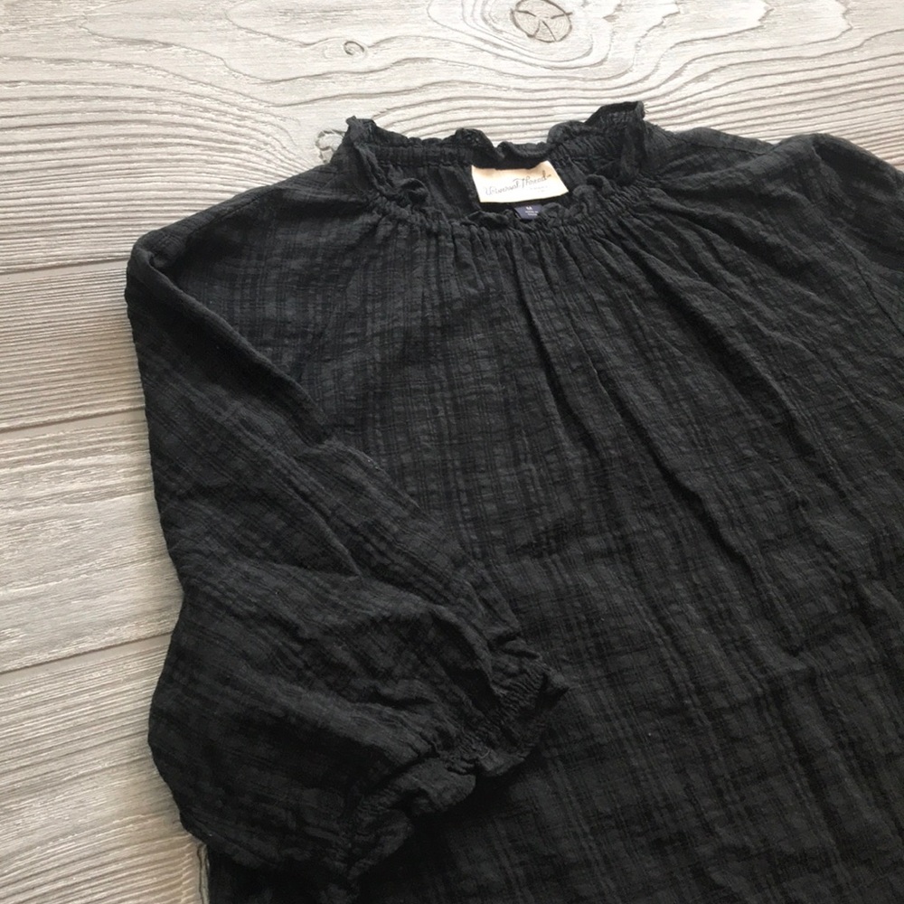 Dark plaid shirt with elastic sleeves and neckline